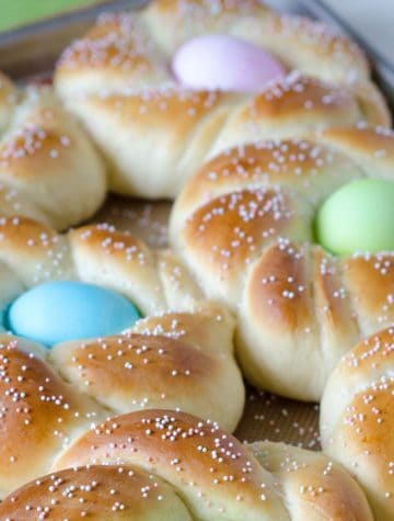 braided Italian Easter bread with dyed eggs in center