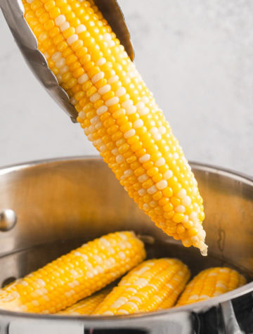 corn cob in pot of water